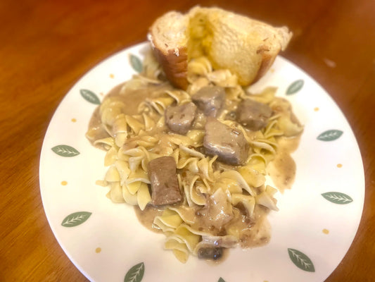 Beef stroganoff served over egg noodles